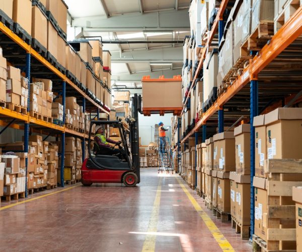 Manager,Wearing,Hard,Hat,With,Digital,Tablet,Counts,Merchandise,In